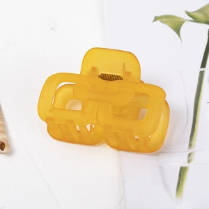 Translucent yellow rectangular hollow claw clip for women made of premium matte acrylic