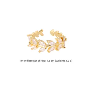 Detail shot of leaf-shaped gold ring showing 1.6cm inner diameter and 3.2g weight