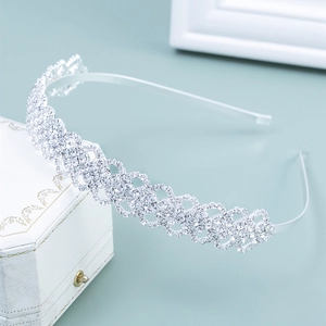 Elegant silver rhinestone headband for brides featuring intricate geometric crystal lattice