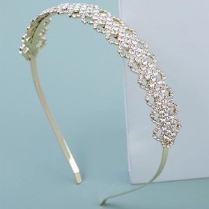 Detailed view of the gold rhinestone headband showing intricate crystal geometric patterns