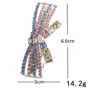Colorful rhinestone bow hair clip in gold alloy with 6.6cm height measurement