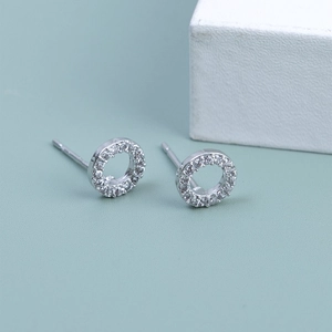 Sparkling 925 silver stud earrings with rotating micro-pave zircon circles on teal background