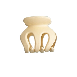 Close-up of a matte cream mini hair claw clip for high ponytail styling and bangs