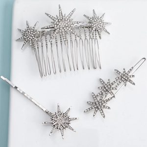 Detailed close-up of sparkling star-shaped hair pin set with rhinestones in silver finish