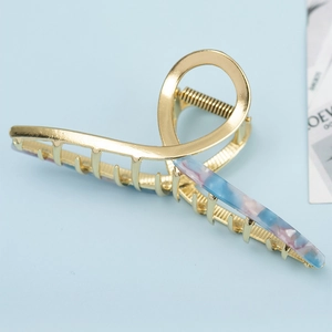 Large golden alloy shark hair claw clip with blue and pink marble acetate inlay