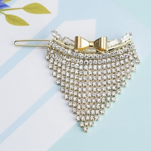 Pince à cheveux dorée avec nœud élégant et glands en strass brillants pour femmes chic