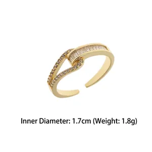 Gold plated open ring with cubic zirconia baguette and round stones, 1.7cm diameter