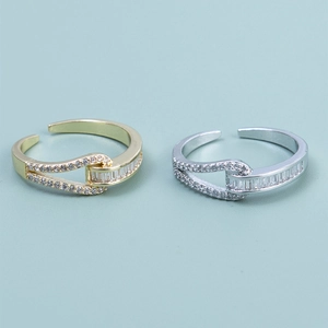 Elegant knotted nested rings in gold and silver with sparkling white cubic zirconia