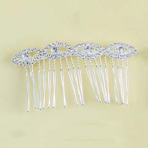 Detail of silver alloy wedding hair comb featuring rhinestone sunflower pattern