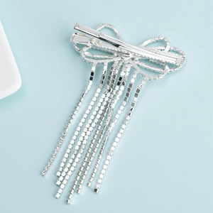 Silver bow hair clip with rhinestone tassels and duckbill clasp back view