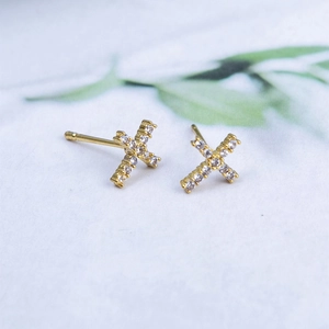 Sparkling S925 silver cross stud earrings featuring gold plating and cubic zirconia stones
