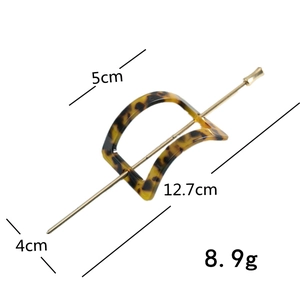 Detail view of acetate hair pin with tortoise shell pattern and metal needle dimensions