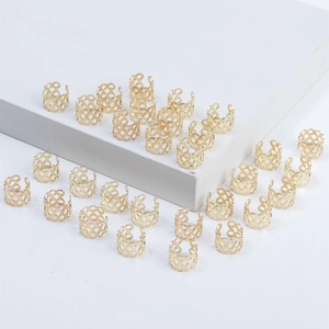 Detailed view of hollow gold mesh hair rings for dreadlocks and ponytail hair accessories