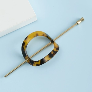 Elegant tortoiseshell acetate hair pin with oval ring and polished metal needle