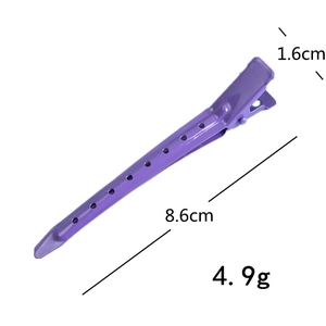 Detail view of a purple 8.6cm metal hair duckbill clip with geometric cutout design