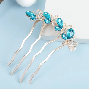 Elegant gold butterfly hair comb with sparkling blue crystals and four wavy teeth