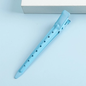 Minimalist light blue metal duckbill hair clip with geometric hollow holes for styling