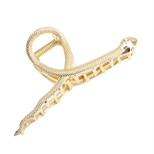 Pinza para el cabello de serpiente en metal dorado con textura de escamas y diamantes