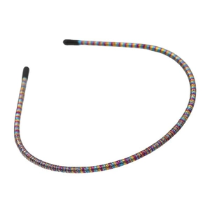Detail view of ultra-thin rainbow headband showing colorful texture and non-slip rubber tips