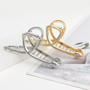 Pinzas para el pelo de serpiente en metal dorado y plateado con detalles de cristal