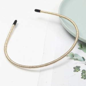 Minimalist ultra-thin gold non-slip headband with glitter finish and protective soft tips
