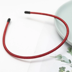 Detail of red slim headband with threaded texture and anti-slip black rubber end tips
