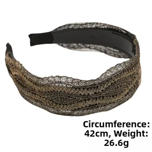 Detail of wide lace headband with rhinestones in golden brown showing the inner non-slip teeth
