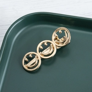 Elegant gold metal smiling face hair clip for women with hollowed hollow out design