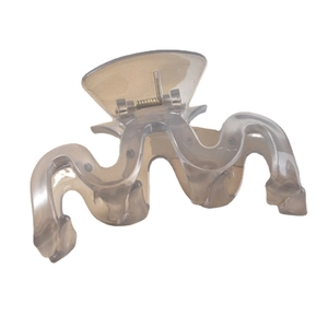 Elegant wavy shark hair claw clip in translucent grey with a modern minimalist design
