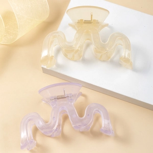Elegant large wavy hair claws in matte beige and lavender tones with metal springs