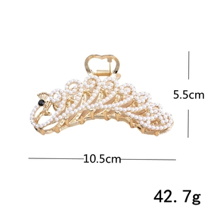 Detailed view of a gold peacock hair claw clip with pearls showing dimensions 10.5cm by 5.5cm
