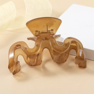 Elegant amber translucent wavy hair claw clip with minimalist resin wave design