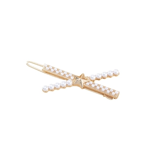 Fermaglio per capelli dorato con design a X, perle bianche e una stella al centro