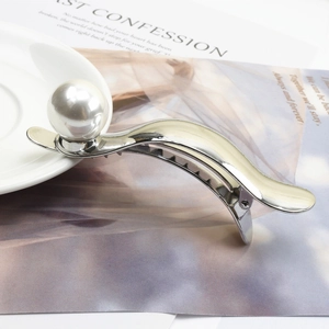 Elegant silver metal hair claw with large white pearl and cream enamel finish