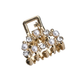 Golden mini hair claw clip with white pearls and sparkling rhinestones for high ponytail