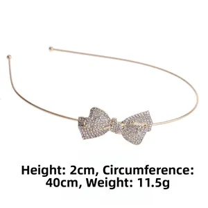 Detail view of gold rhinestone bow headband with 2cm height and 40cm circumference