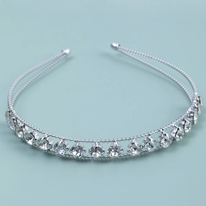 Close-up of double-row silver headband with sparkling rhinestones in four-prong settings