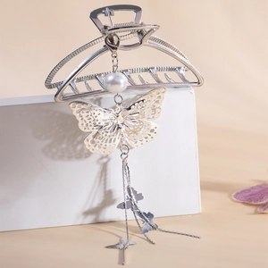 Silver alloy hair claw clip with hollow butterfly charm, pearl and long tassel chain