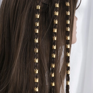Golden crown hair ring accessories for braids with hollow floral design on dark hair