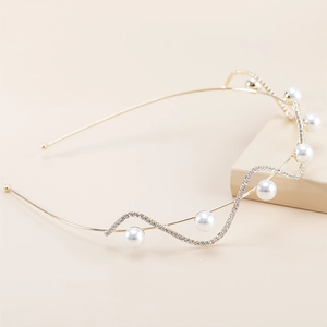 Elegant wavy gold headband with white pearls and sparkling rhinestones for women