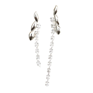 Detail of silver tassel earrings with leaf-shaped studs and dangling zircon chains
