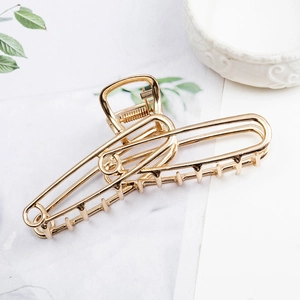 Elegant gold large metal hair claw clip with geometric hollow design for thick hair styling