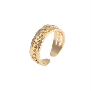 Gold plated copper open ring with irregular texture and three clear zircon stones