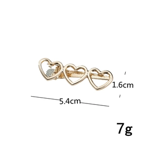 Detailed view of 5.4cm gold heart hair clip with dimensions and metal texture