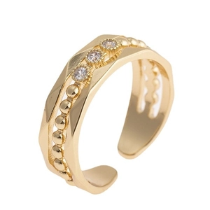 Minimalist gold open ring with geometric cut surface and three white zircon stones