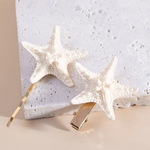 Handmade starfish hair clips in ivory white and gold for beach vacations and styling