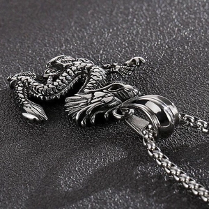 Macro shot of detailed punk style dragon pendant with scales in vintage silver finish