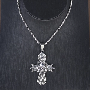 Detail view of punk skull cross pendant with vintage black stainless steel finish