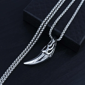 Retro stainless steel wolf tooth pendant necklace with flame pattern on a box chain