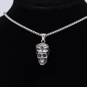 Gothic skull pendant necklace with goggles in vintage stainless steel on black display